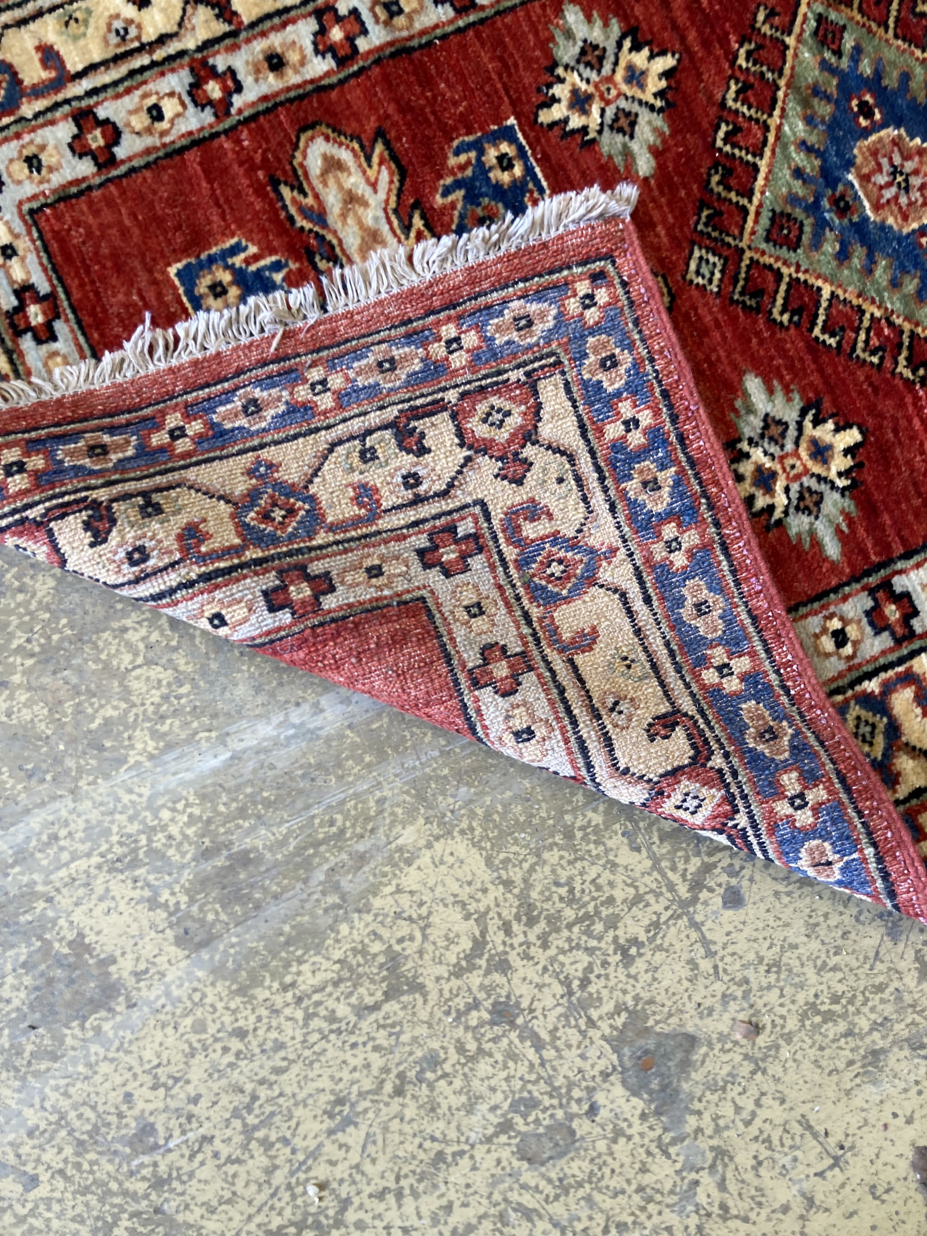 A Kazak style red ground runner, 200 x 84cm